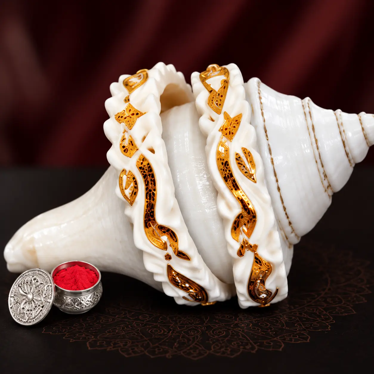 Pair of conch shell shankha bangles bound with gold filigree work
